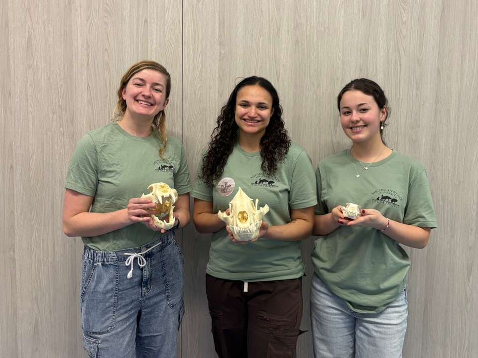 Jana, Madison, and Isa teach kids about hyenas at Girls Math and Science Day.